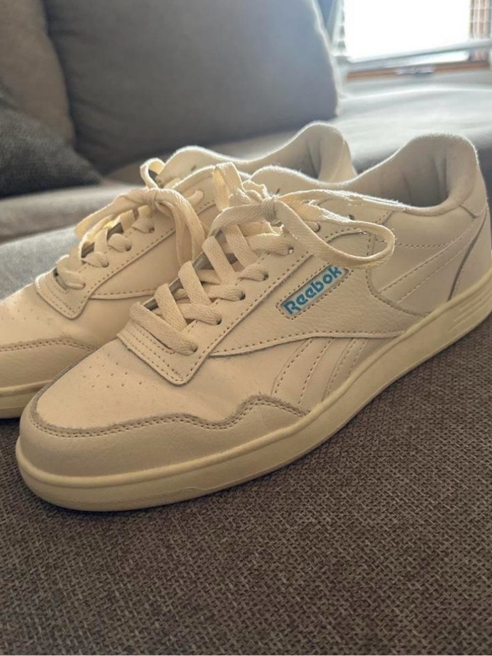 Reebok Cream Sneakers with Blue Logo Accent